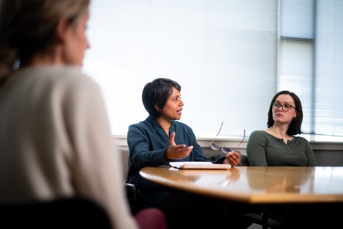 Ayanna Thomas, Psychology Professor and Dean of Research for Arts and Sciences, engages in a research team meeting.